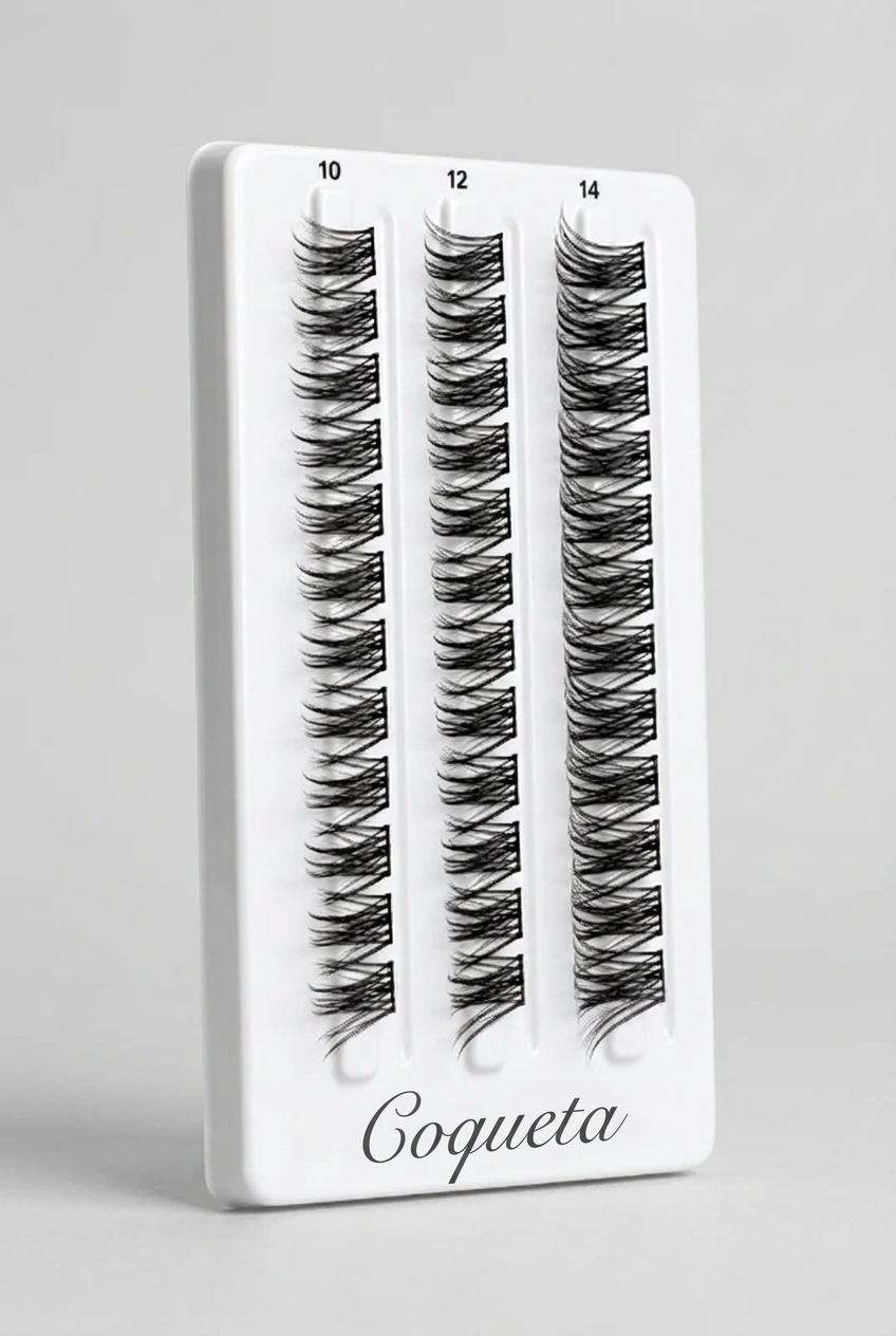 Three pairs of black false eyelashes on a white plastic tray, labeled 10, 12, and 14 at the top.